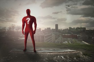 Superhero with question mark costume overlooking cityscape