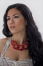 Asian woman wearing flower necklace