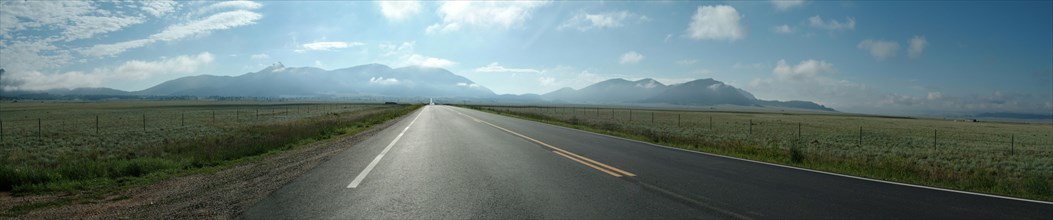 Panoramic view of empty road in rural landscape