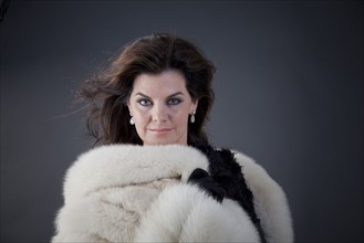 Caucasian woman wearing fur coat