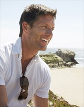 Smiling man enjoying beach