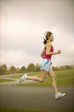 Woman jogging on path