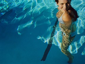 Woman standing in swimming pool