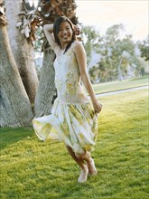 Happy woman dancing in field