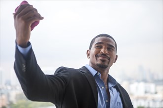 African American businessman taking selfie with cell phone