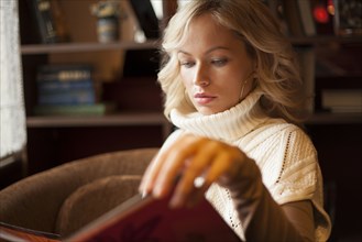Caucasian woman reading book