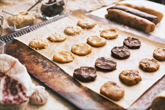 Cookies on baking sheet near ingredients