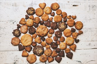 Variety of cookies on wooden table