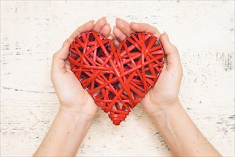 Hands of woman holding handmade valentine