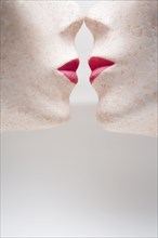 Female mannequin heads kissing
