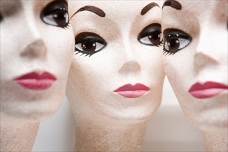 Three female mannequin heads