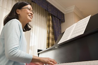 Chinese woman playing piano