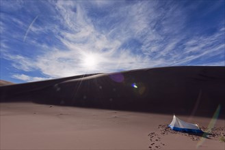 Camping tent in desert sand dunes