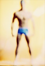 Defocused man standing in underwear