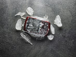 Cell phone frozen in broken ice