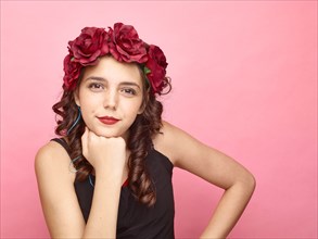 Girl with flowers in hair wearing makeup