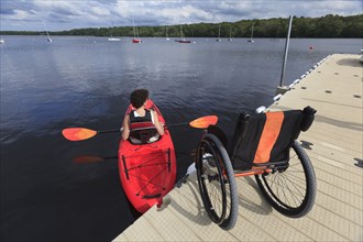 Caucasian paraplegic woman rowing kayak