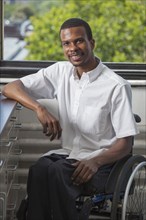 African American paraplegic man smiling