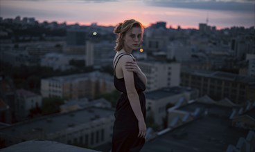 Portrait of serious Caucasian teenage girl overlooking cityscape