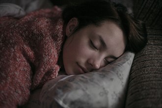 Caucasian woman sleeping on pillow