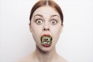 Caucasian woman with mouthful of sushi