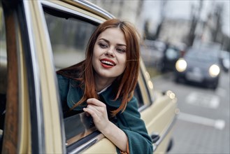 Smiling Caucasian woman in back seat of car