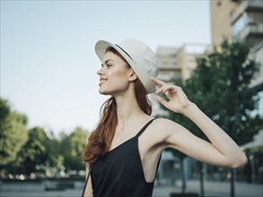 Portrait of Caucasian woman holding hat