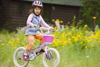 Portrait of girl riding bike