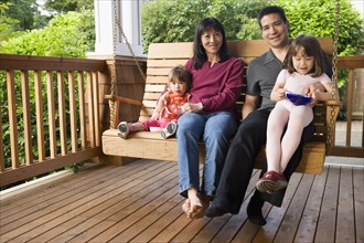 Portrait of family on porch swing