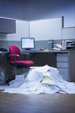 Mountain of paper in office space