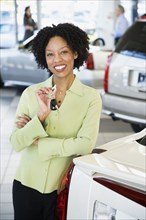 Car saleswoman smiling