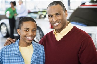 Father and son at a car dealership