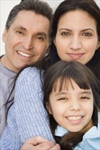 Close up of Hispanic family smiling