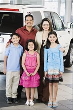 Hispanic family at car dealership
