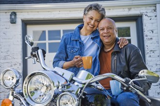 Senior African American couple on motorcycle