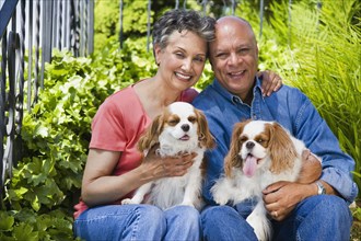 Senior African American couple with dogs