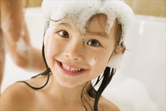 Asian girl in bubble bath