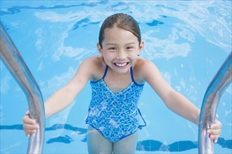 Young Asian girl in swimming pool