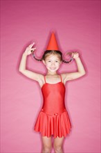 Asian girl in hat and ballet costume