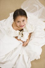 Asian girl trying on wedding dress