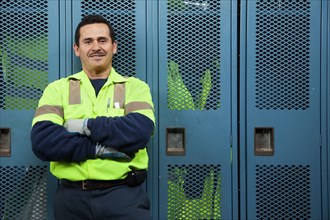 Hispanic sanitation worker in locker room