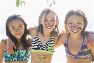 Smiling friends in face paint