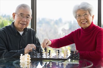 Chinese couple playing chess