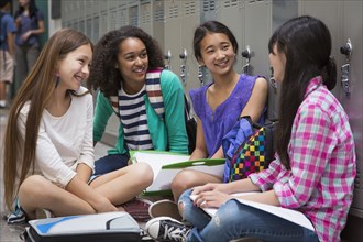 Students talking in school corridor