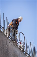 Caucasian worker on top of building