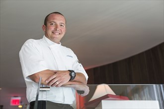 Low angle view of chef standing in dining room