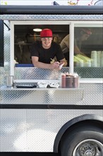 Caucasian man working in food truck