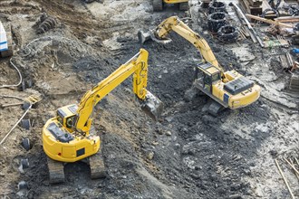Aerial view of diggers at construction site