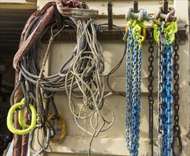 Chains and cords hanging on hooks