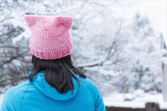 Japanese woman wearing pink hat with ears